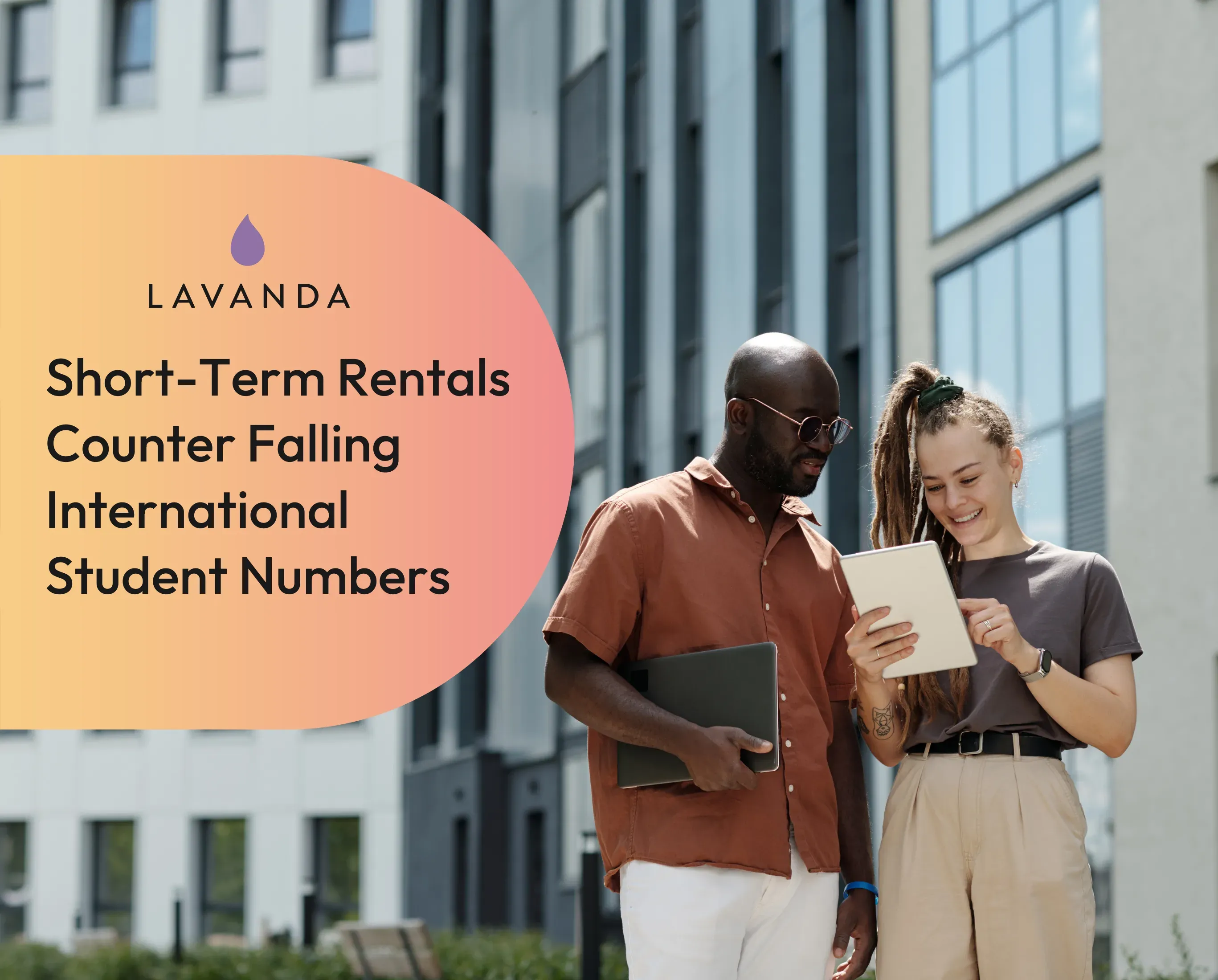 Short-term rentals counter falling international student numbers, over two students reading a tablet outside a modern block.