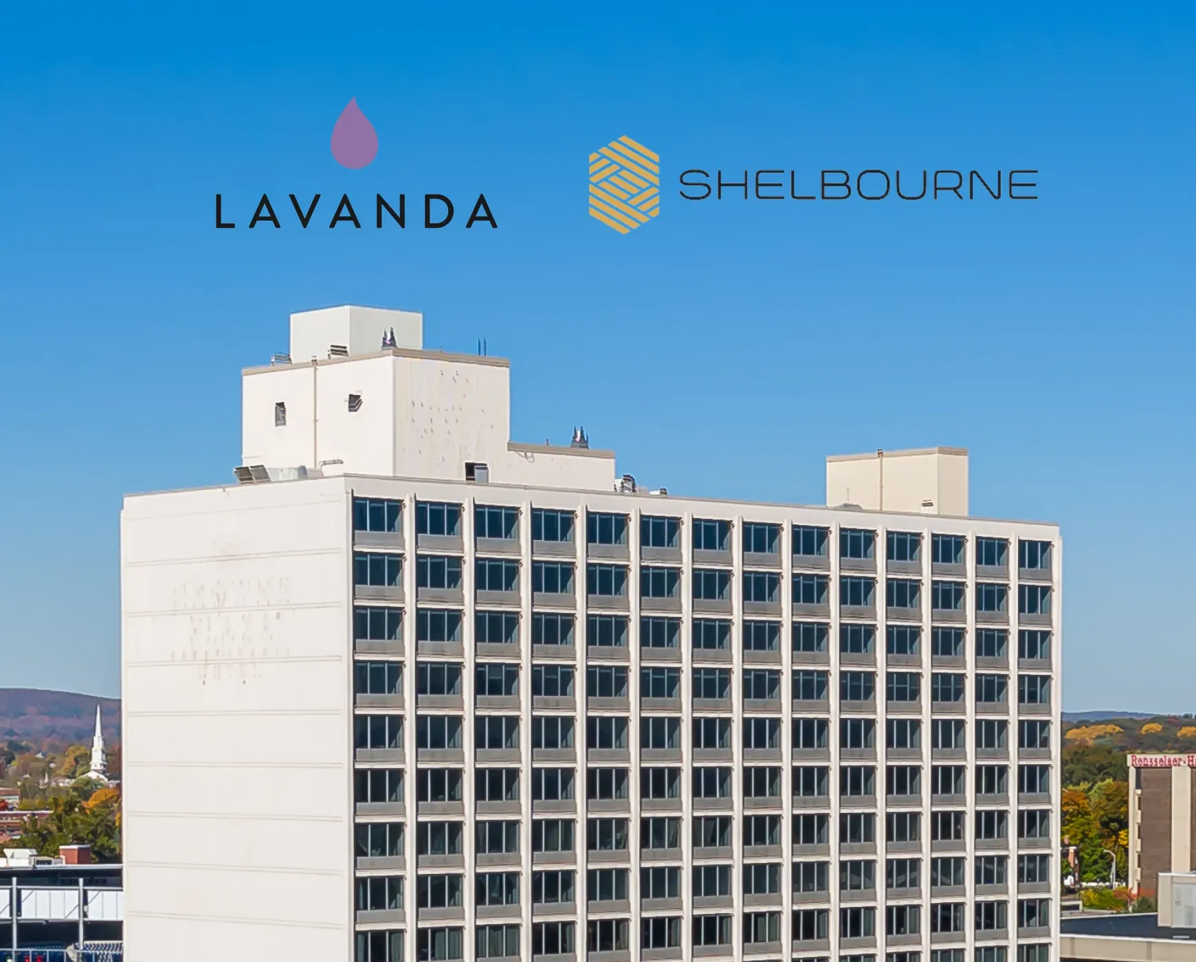The Lavanda and Shelbourne marks above a white mid-century apartment block against a clear sky.