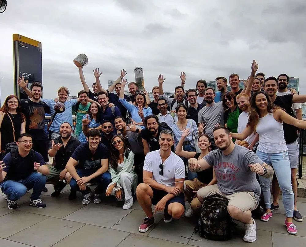 The Lavanda team gathered on a rooftop for a group photograph, several with their arms raised.